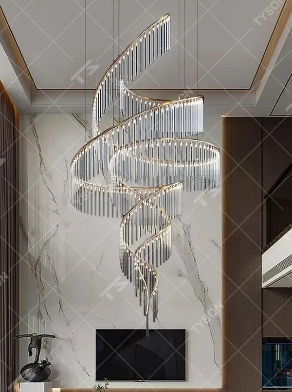 This large custom art chandelier features a gold metal frame paired with hanging crystal tassels to create a flowing ribbon shape, serving both lighting and artistic decoration purposes, ideal for high-ceiling commercial spaces such as high-end clubs, hotel lobbies, and sales offices.
