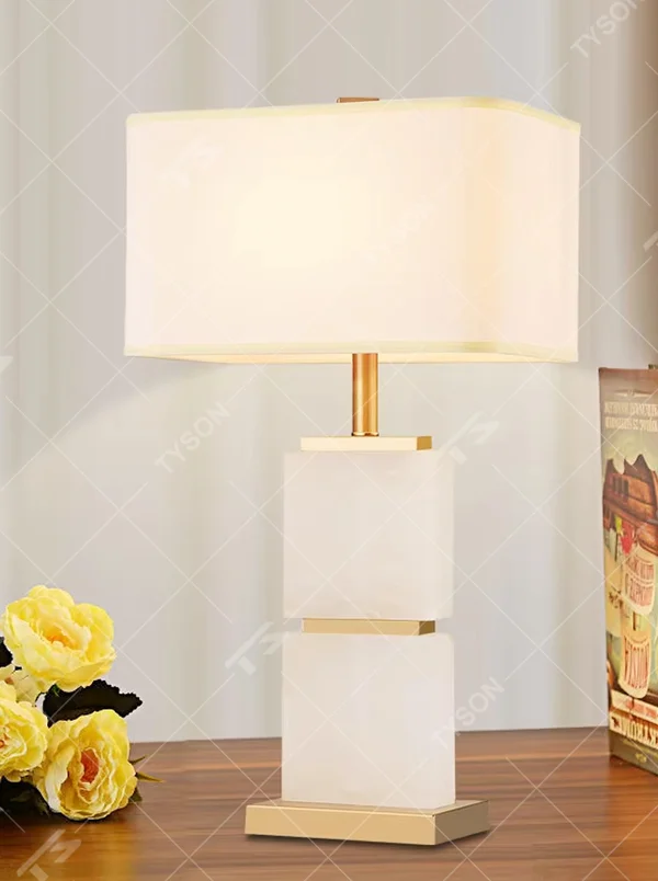 Light luxury stacked marble table lamp, featuring natural marble blocks stacked with a gold metal frame and a rectangular fabric lampshade, providing soft and eye-protective lighting, designed to enhance space texture, suitable for bedroom nightstands, living room side tables, hotel guest rooms, etc.