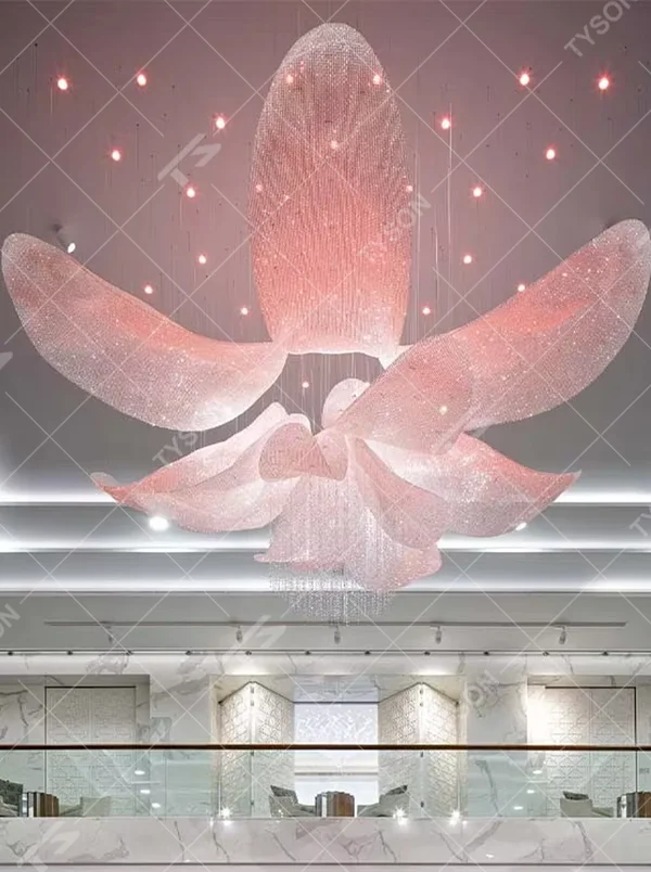 This large-scale art chandelier features a blooming flower shape, with petal structures made of translucent crystal/acrylic material, paired with gradient blue-purple lighting and starry sky accents. It serves both lighting and artistic decorative purposes, ideal for high-ceiling commercial spaces such as hotel lobbies, sales offices, and high-end clubs.