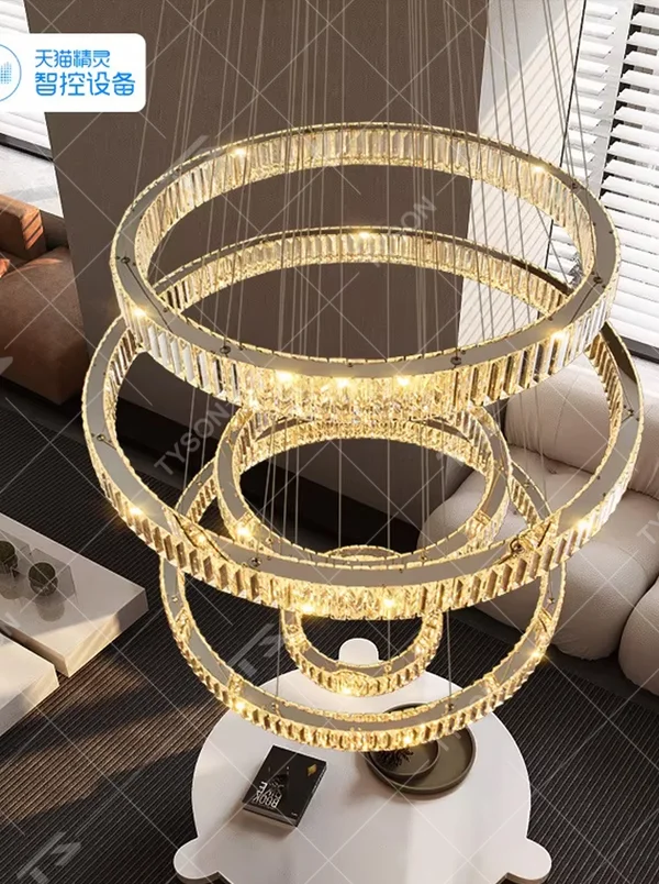 This light luxury spiral ring chandelier features a gold metal frame with embedded crystal/acrylic light strips, in a multi-layer scattered spiral shape, serving both lighting and decorative purposes, ideal for high-end high-ceiling spaces such as villa high-ceiling staircases, hotel lobbies, and sales offices.