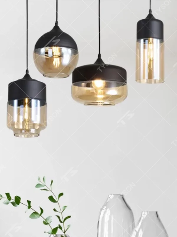 This set of Nordic-style creative small chandeliers features black metal top covers paired with amber glass lampshades, with various shapes that can be hung in combination, serving both lighting and decorative purposes, ideal for dining rooms, bars, Nordic-style homes and other scenarios.
