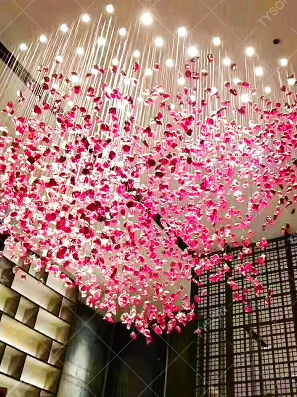 Gradient blue and white art engineering chandelier, crafted from transparent and turquoise crystal fragments to create a water-drop gradient shape, with transparent and brilliant light, designed to create a high-end artistic space atmosphere, suitable for large high-end scenarios such as hotel lobbies, sales office reception halls, and club high-ceiling spaces