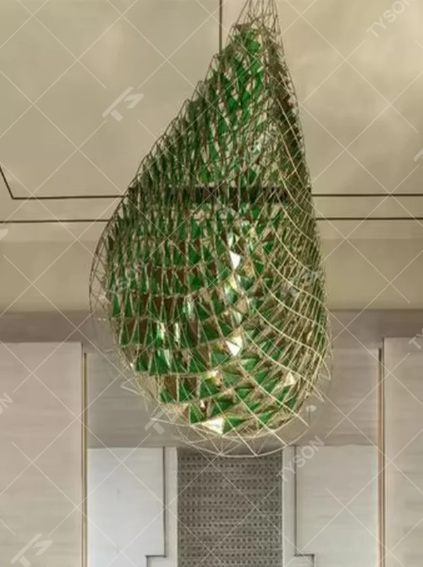 Water-drop shaped light luxury art chandelier with a metal woven frame and green decorative pieces, featuring soft light transmission, designed to enhance the artistic atmosphere of spaces, suitable for high-end indoor scenarios such as hotel lobbies, clubs, and villa entrances