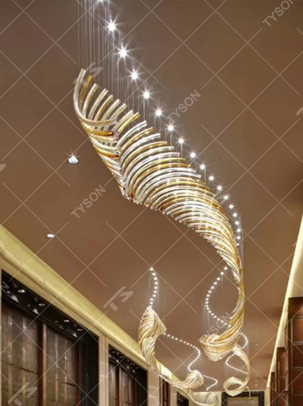 This large art chandelier features wing-flapping shapes made of transparent and gold crystal strips, hung staggered with slender suspension rods, serving both lighting and artistic decoration purposes, ideal for high-ceiling commercial spaces such as hotel lobbies, high-end clubs, and sales offices.