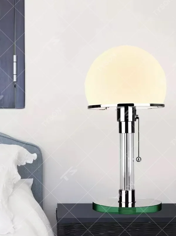 Modern light luxury adjustable-height mushroom table lamp, with a milky white spherical lampshade paired with a chrome-plated + transparent acrylic adjustable-height lamp pole, featuring a pull-chain switch, and a green acrylic base, emitting soft and even light, combining decorativeness and practicality, suitable for lighting and decoration in spaces such as bedroom nightstands, study desks, and living room side tables.