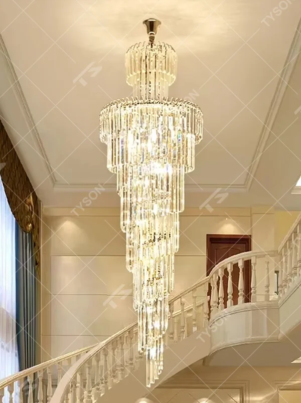 This is an European-style luxurious long cone-shaped crystal chandelier, featuring a pagoda-style structure crafted from multi-layer dense crystal strips, emitting brilliant and gorgeous light, serving both lighting and decorative purposes, suitable for villa high-ceiling staircases, duplex void living rooms, hotel lobbies and other scenarios.