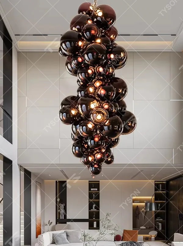 Artistic grape-cluster shaped chandelier, composed of hand-blown glass balls in a deep purple to black gradient, arranged in a cascading stacked structure. Light passes through the glass balls to create a transparent and brilliant effect, combining artistic decorativeness and lighting function, suitable for core decoration and ambient lighting in high-ceiling spaces such as duplex stairs, high-end clubs, and villa living rooms.
