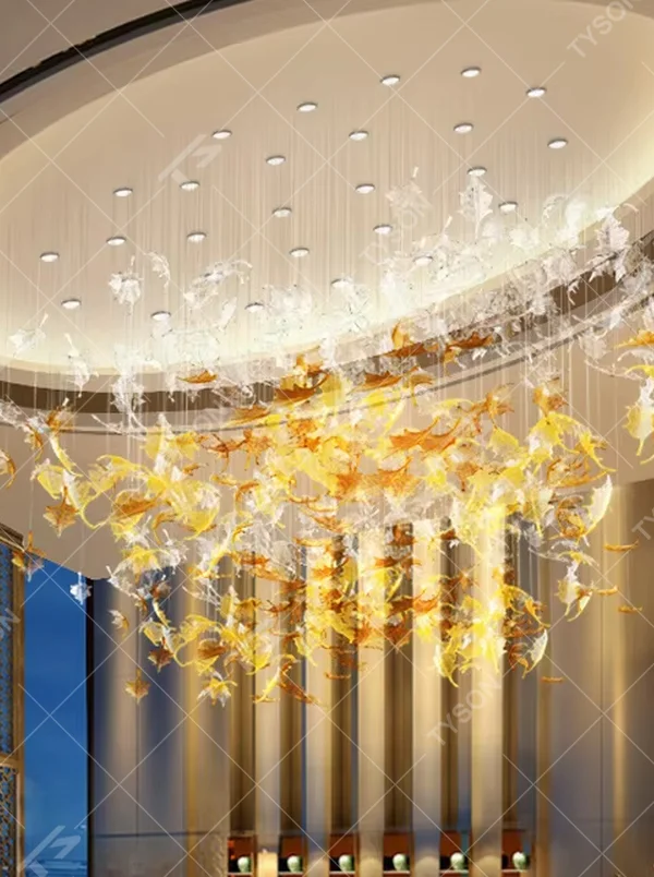 Modern art large chandelier, with leaf-shaped glass/acrylic in white to yellow-orange gradient as the main body, hanging in a suspended staggered manner, emitting transparent and brilliant light, combining artistic decorativeness and lighting function, suitable for core decoration and main lighting in large high-end spaces such as hotel lobbies, high-end clubs, and sales offices.
