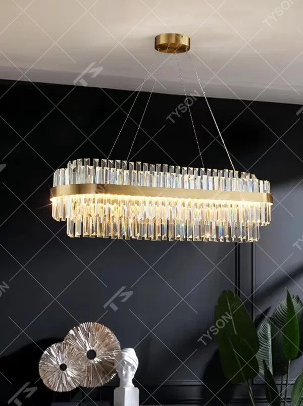 This is a light luxury style multi-layer circular crystal chandelier, featuring a gold metal frame paired with transparent cut crystal strips. The light refracts through the crystals to create a brilliant and luxurious lighting effect, serving both lighting and decorative purposes, and is suitable for quality-focused scenarios such as villa living rooms, duplex high-ceiling spaces, hotel lobbies, and high-end restaurants.