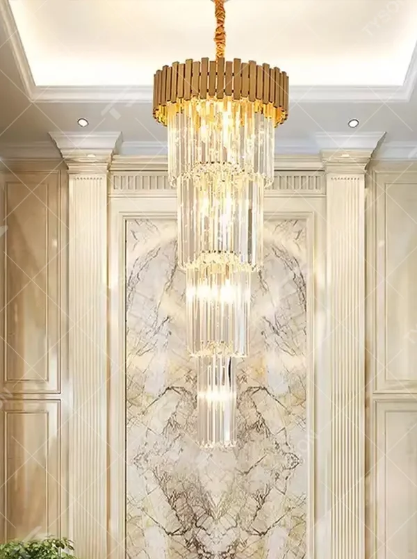 This is a light luxury and luxurious style multi-layer crystal chandelier, with a gold metal top paired with a transparent crystal column pendant structure, which has both lighting and decorative functions, suitable for high-end spaces such as villa high-ceiling living rooms, duplex stairwells, and hotel lobbies.