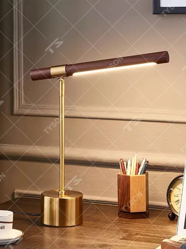 This is a modern minimalist style eye-protecting table lamp, featuring a walnut lamp head paired with a brass metal lamp pole and base. The linear lighting design is soft and non-glaring, serving both practical lighting and decorative purposes, suitable for study rooms, bedroom nightstands, light luxury office areas and other scenarios.