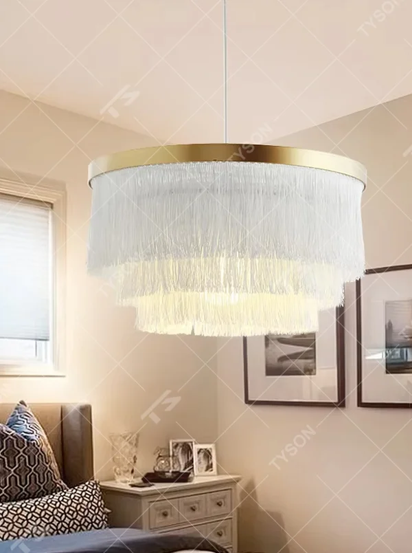 Modern light luxury multi-layer tassel chandelier, with a gold metal top ring paired with three layers of white cascading tassel lampshades, emitting soft and warm light, combining decorativeness and lighting function, suitable for core lighting and atmosphere creation in spaces such as bedrooms, dining rooms, and cloakrooms.