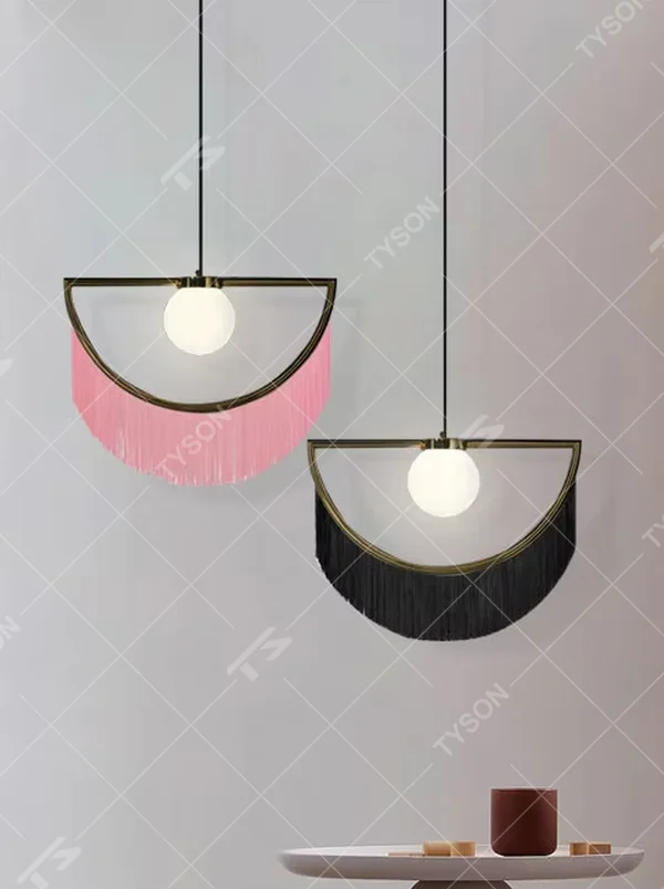 Modern minimalist semicircular tassel pendant lamp, with black-gold/pink-gold metal semicircular frames paired with semi-transparent lampshades, cascading same-color tassel decorations, built-in spherical light sources, emitting soft and warm light, combining decorativeness and lighting function, suitable for accent lighting and atmosphere creation in spaces such as bedroom nightstands, restaurant bars, and children's rooms.