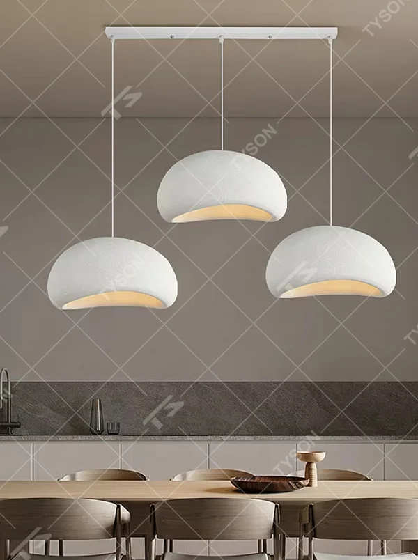 This is a wabi-sabi style hemispherical chandelier, crafted from a textured gray cement-like material, emitting soft warm light from its edge, serving both lighting and decorative purposes, suitable for wabi-sabi style dining rooms, Japanese tea rooms, minimalist living rooms, homestay guest rooms and other scenarios pursuing a relaxed feeling.