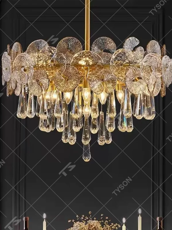 Modern light luxury double-layer crystal chandelier, with a gold metal frame paired with fan-shaped textured crystal slices and cascading crystal columns, emitting brilliant and luxurious light, combining artistic decorativeness and lighting function, suitable for core lighting and atmosphere creation in spaces such as dining rooms, living rooms, and villas.