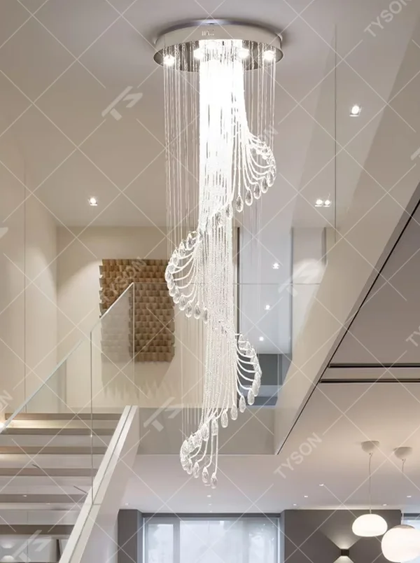 This is a modern light luxury style artistic crystal chandelier, composed of multiple layers of transparent crystal strings and teardrop-shaped crystal pendants. Its streamlined shape resembles a flowing waterfall of light, serving both lighting and artistic decoration purposes, suitable for high-ceiling spaces such as villa high-ceiling living rooms, duplex voids, hotel lobbies, and high-end clubs.