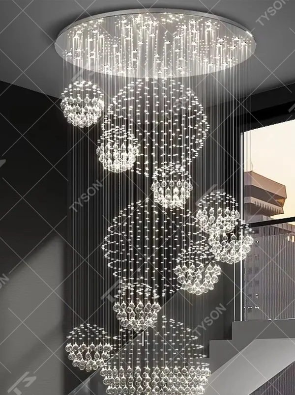 Modern luxury crystal ball cluster cascading chandelier, with a circular metal top plate paired with multiple groups of crystal-strung ball clusters hanging staggered, emitting brilliant and dreamy light, combining artistic decorativeness and lighting function, suitable for core decoration and main lighting in high-ceiling spaces such as duplex stairs, villa hollow areas, and high-end clubs.