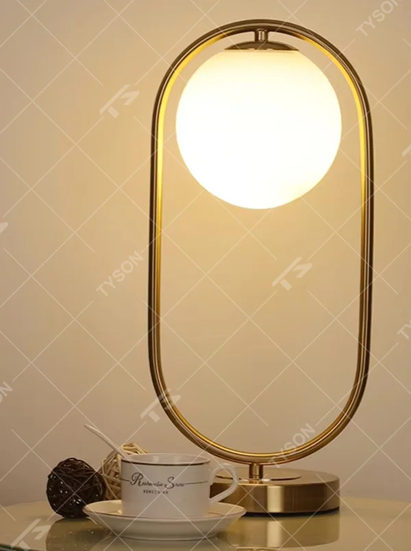 Modern minimalist oval-frame spherical table lamp, with a black metal oval frame paired with a milky white luminous bulb, emitting soft and even light, combining decorativeness and practicality, suitable for lighting and decoration in spaces such as bedroom nightstands, living room side tables, and office desks.
