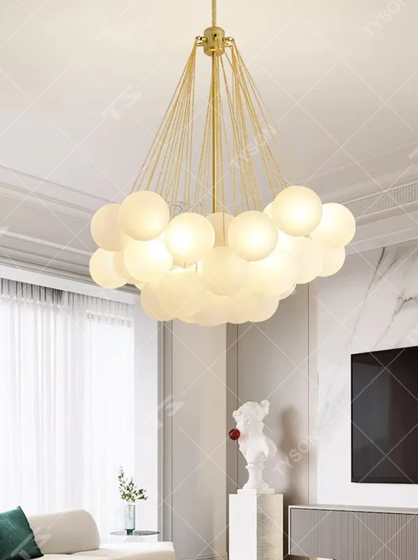 Modern light luxury cloud-shaped chandelier, with a golden metal frame and milky white glass ball lampshades stacked into a full cloud shape, featuring soft and warm light, combining decorative and lighting functions, suitable for living rooms, dining rooms, bedrooms and other modern style spaces.