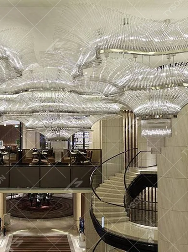 This large wave-shaped crystal ceiling lamp consists of dense high-transparency crystal strips forming a flowing wave pattern, covering the entire ceiling, with soft and brilliant light, serving both lighting and installation art purposes, suitable for large high-ceiling spaces such as hotel lobbies and high-end commercial atriums.