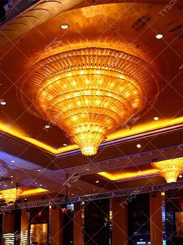 European luxury dome-style multi-layer crystal chandelier, with a golden metal frame and transparent crystal layered structure, featuring bright and grand light, combining main lighting and space decoration functions, suitable for large-scale commercial spaces such as hotel banquet halls, high-end clubs, and large conference halls.