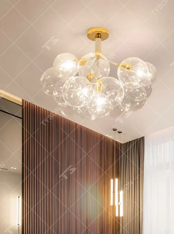Modern light luxury bubble glass semi-flush mount ceiling light, with a golden base paired with transparent glass ball lampshades stacked into a cloud shape, featuring transparent and soft light, combining decorative and lighting functions, suitable for living rooms, bedrooms and other modern style spaces.