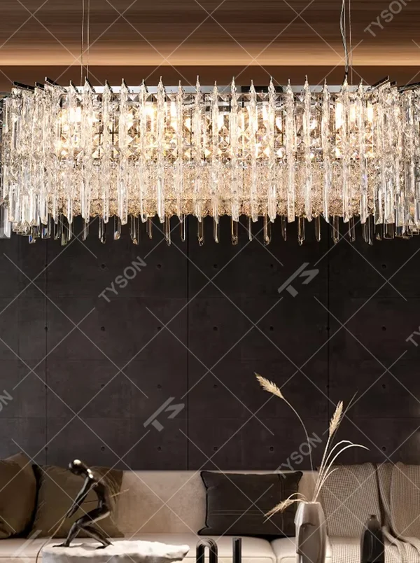 Modern light luxury rectangular multi-layer crystal chandelier, with a metal frame and layered transparent crystal strips, featuring bright and soft light, combining decorative and lighting functions, suitable for dining rooms, living rooms, high-end clubs and other modern style spaces.