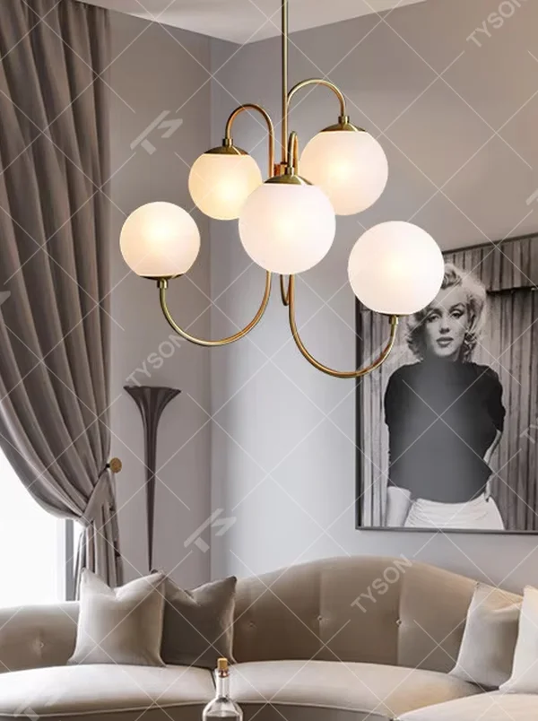 This light luxury golden cloud bubble chandelier features a gold curved metal frame paired with multiple white spherical frosted lampshades, with soft and uniform light, serving both lighting and decorative purposes, suitable for modern light luxury spaces such as living rooms and dining rooms.