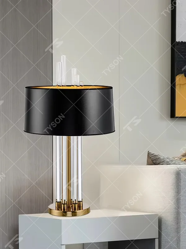 Modern Light Luxury Gold & Crystal Table Lamp, Black Cylindrical Fabric Lampshade (Gold Interior), Transparent Crystal Strips and Gold Metal Strips Combined Lamp Body with Crystal Decor on Top, Serves Both Lighting and Decorative Purposes, Ideal for Living Rooms, Bedrooms, Studies, Hotel Guest Rooms and Other Light Luxury Spaces.
