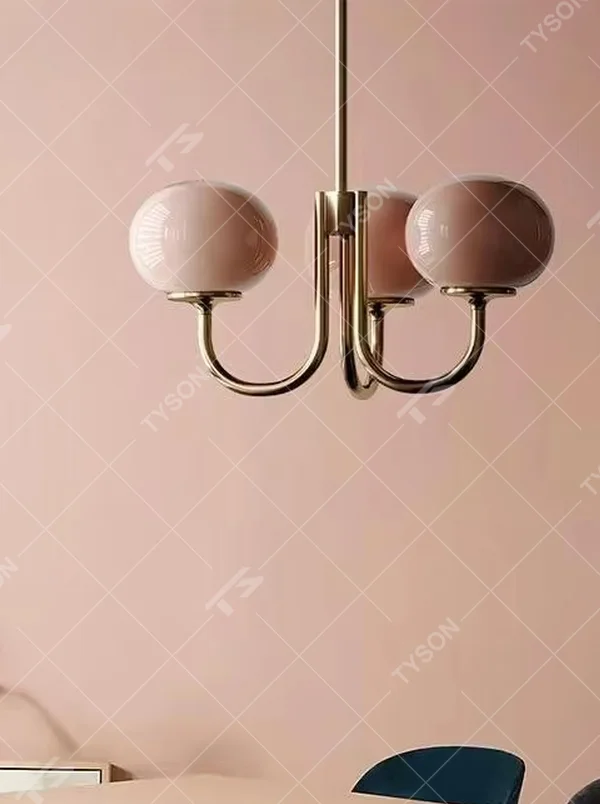 This light luxury pink-gold spherical chandelier features a curved bracket made of gold metal, paired with three pink gradient spherical lampshades, with soft and romantic light, serving both lighting and decorative purposes, suitable for warm spaces such as dining rooms and bedrooms.
