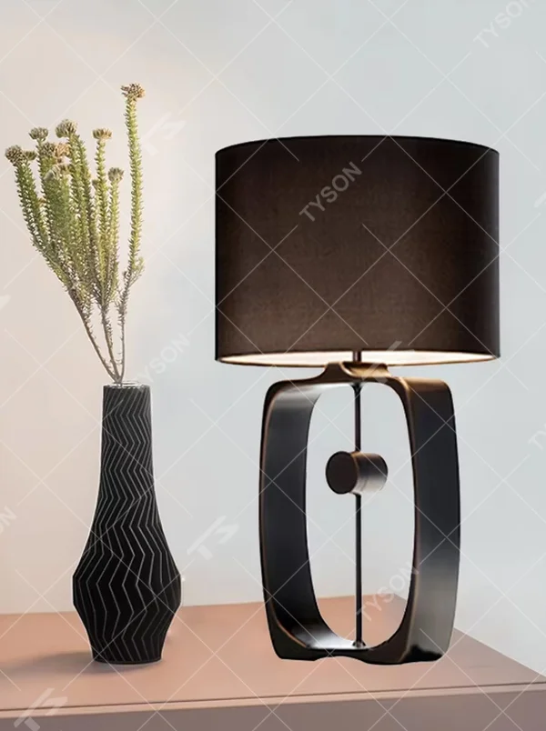 Modern Minimalist Geometric Metal Table Lamp, Black Cylindrical Fabric Lampshade, Hollow Ring Black Metal Lamp Body, Serves Both Lighting and Decorative Purposes, Ideal for Bedrooms, Living Rooms, Studies, Modern Office Spaces, etc.