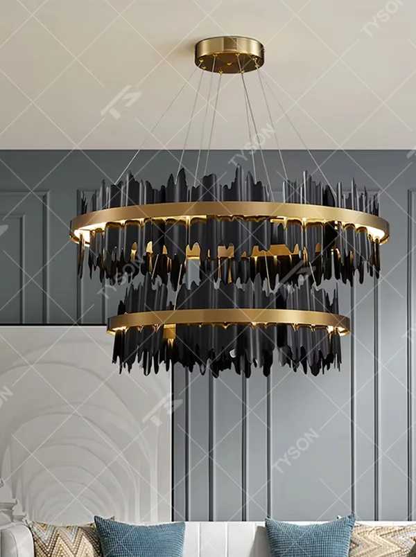 A light luxury and glamorous double-layer ring chandelier, featuring a gold metal frame paired with irregular black hanging glass panels. It emits a brilliant yet soft glow when lit, combining decorative appeal with practical illumination, ideal for creating a high-end and mysterious space atmosphere.