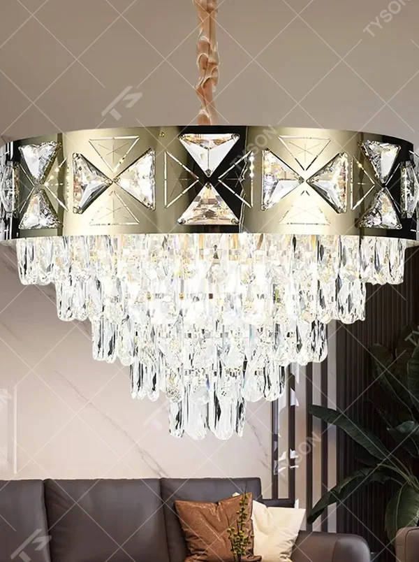 This is a luxurious round crystal chandelier, with a gold metal frame inlaid with cut crystal decorations, and cascading crystal strips hanging below, featuring brilliant and soft light, both decorative and lighting functions, ideal for high-end indoor spaces such as living rooms and dining rooms.