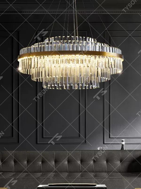 A modern light luxury style circular double-layer crystal chandelier, featuring a gold metal frame paired with multiple layers of long cut crystal strips. It emits a brilliant and soft glow when lit, combining decorative appeal with practical illumination, ideal for creating a luxurious and high-end space atmosphere.