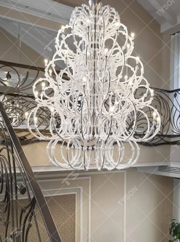This large white crystal corolla art chandelier is handcrafted with high-transparency glass/crystal into a layered, curled ring structure, forming a blooming corolla shape, with brilliant and soft light, serving both lighting and decorative purposes, suitable for high-end high-ceiling spaces such as villa high-ceiling living rooms and hotel lobbies.