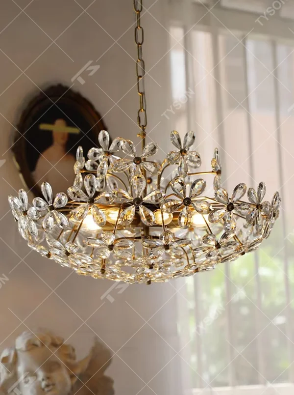 A French light luxury style double-layer crystal petal chandelier, featuring a gold iron frame inlaid with K9 crystal petal decorations. It emits a brilliant and soft glow when lit, combining decorative appeal with practical illumination, ideal for creating a romantic and retro space atmosphere.