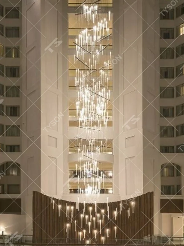 This modern light rain art lighting group consists of a large number of slender linear light strips hanging vertically, creating a "pouring light rain" visual effect with a wooden background wall, serving both lighting and installation art purposes, suitable for high-ceiling commercial spaces such as hotel lobbies and convention centers.