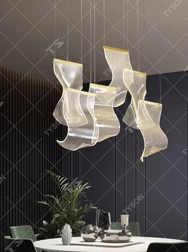 A modern light luxury style layered art chandelier, featuring irregularly folded transparent glass panels suspended by thin wires, with gold trim on the edges. It emits a soft and transparent glow when lit, combining decorative appeal with practical illumination, ideal for creating a high-end and dreamy space atmosphere.
