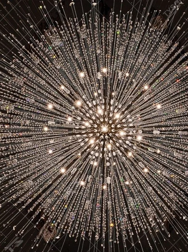 This is a large luxurious starry sky hanging crystal chandelier, supported by a circular metal frame with densely hanging crystal beads, presenting a brilliant starry effect, with both decorative and lighting functions, ideal for high-ceiling commercial spaces such as hotel lobbies and high-end clubs.