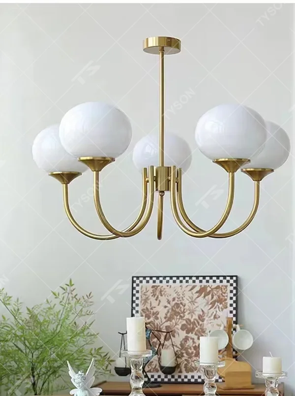 French light luxury peach pink gradient glass ball chandelier, with a golden metal frame paired with pink-orange gradient glass ball lampshades, featuring a soft and sweet shape, warm and gentle light, combining decorative and lighting functions, suitable for bedrooms, children's rooms, girlish heart spaces and other light luxury style scenarios.