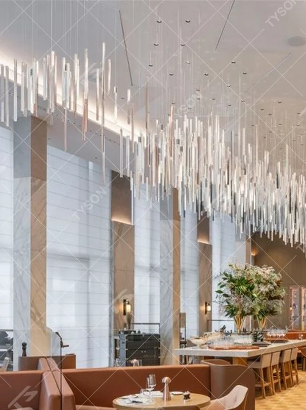 This is a modern minimalist large pendant crystal chandelier, composed of densely hung transparent and translucent crystal tubes, creating a dynamic light waterfall effect, with both decorative and lighting functions, ideal for high-ceiling commercial spaces such as high-end restaurants and hotel lobbies.