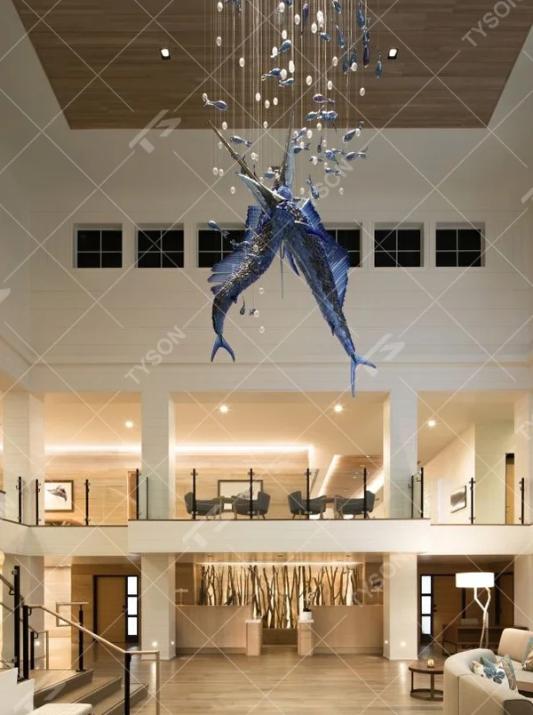 This ocean-themed art chandelier features swordfish shapes made of blue liuli, paired with bubble decorations, presenting a dynamic deep-sea swimming effect, serving both lighting and decorative purposes, suitable for coastal hotels, seafood restaurants and other spaces.