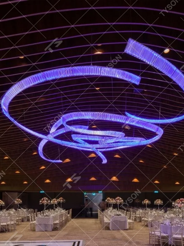This red spiral crystal art chandelier is composed of red crystal strips spliced into a flowing spiral shape. Light refracts through to emit a brilliant halo, serving both lighting and installation art purposes, suitable for trendy commercial spaces such as bars and clubs.