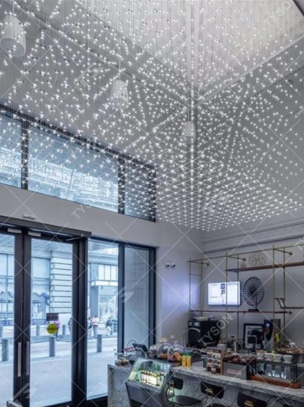 Modern artistic matrix-style hanging crystal lamp group, composed of dense crystal particles/LED beads suspended by thin wires to form a transparent light curtain, combining decorative and ambient lighting functions, suitable for high-ceiling spaces such as hotel lobbies, commercial atriums, and art exhibition halls.