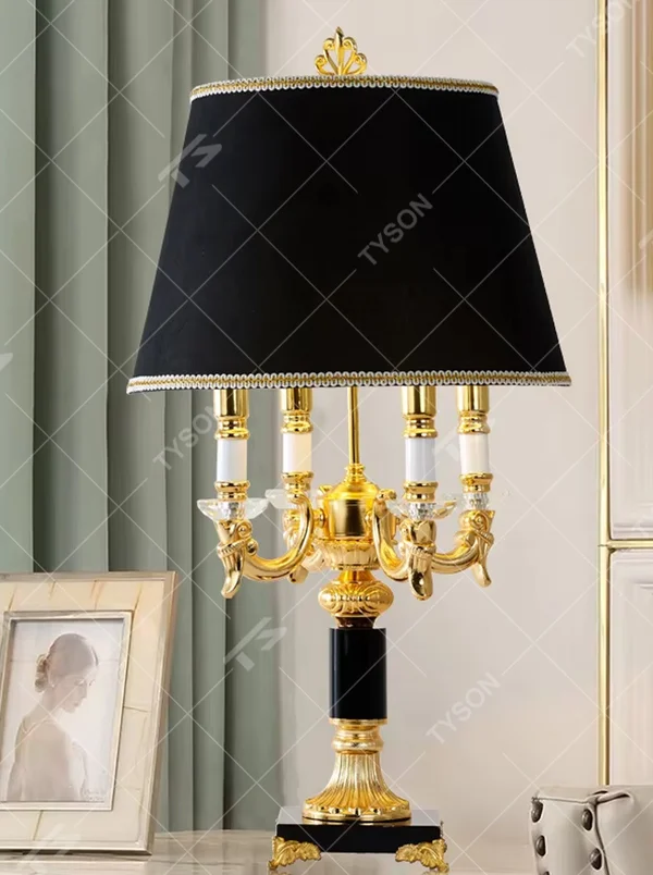 This European court-style table lamp features a carved lamp frame made of glossy gold metal, paired with a crystal ball base and a pleated fabric lampshade (trimmed with gold edging). It presents a luxurious and retro texture, with soft and warm light, serving both lighting and decorative purposes, suitable for European-style bedrooms, villa guest rooms and other spaces.
