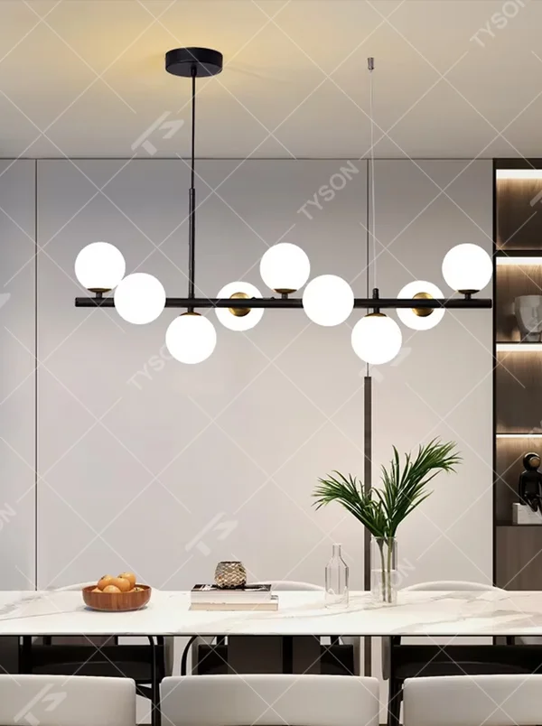 Modern minimalist long strip molecular ball chandelier, with a black and gold metal long rod and milky white glass ball lampshades, featuring a flexible and lightweight linear molecular structure, soft and uniform light, combining decorative and lighting functions, suitable for dining rooms, bars, living rooms and other modern style spaces.
