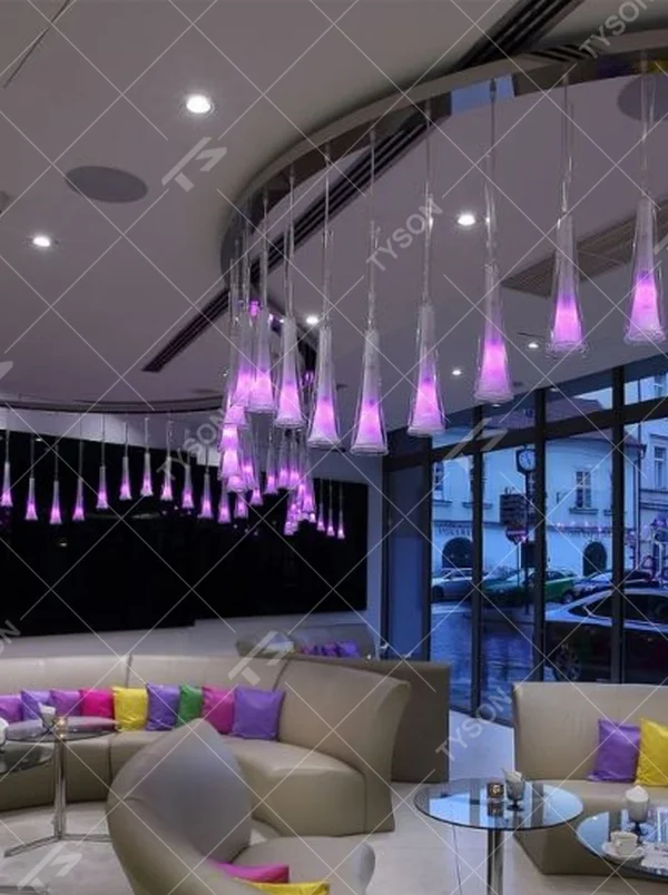This modern gradient cone LED chandelier features transparent conical lampshades paired with LED gradient pink-purple light sources, arranged in a staggered drooping manner with slender suspension rods, with soft and dreamy light, serving both lighting and decorative purposes, suitable for modern entertainment commercial spaces such as bars and lounges.