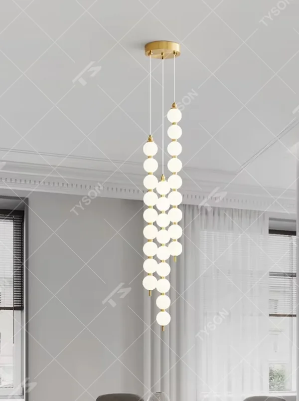 Modern Light Luxury Cascading Dual-Strand Sphere Chandelier, Composed of Milk White Spherical Lamps Connected in a Layered Drooping Design, Gold Metal Ceiling Base, Serves Both Lighting and Decorative Purposes, Ideal for High-Ceiling Dining Rooms, Villa Living Rooms, Duplex Stairwells, etc.