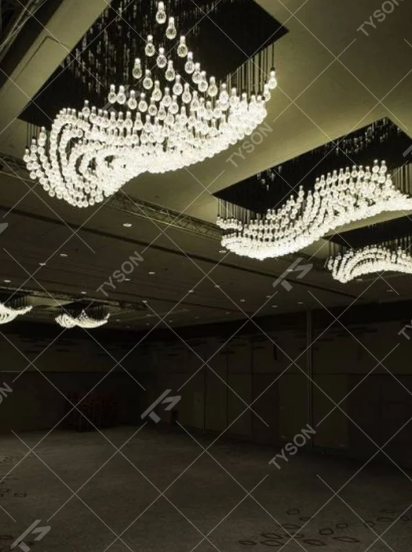 Modern artistic wavy hanging crystal chandelier, with a black metal frame and dense crystal particles creating a flowing wavy shape, combining decorative and main lighting functions, suitable for large-scale commercial spaces such as large banquet halls, exhibition centers, and high-end clubs.
