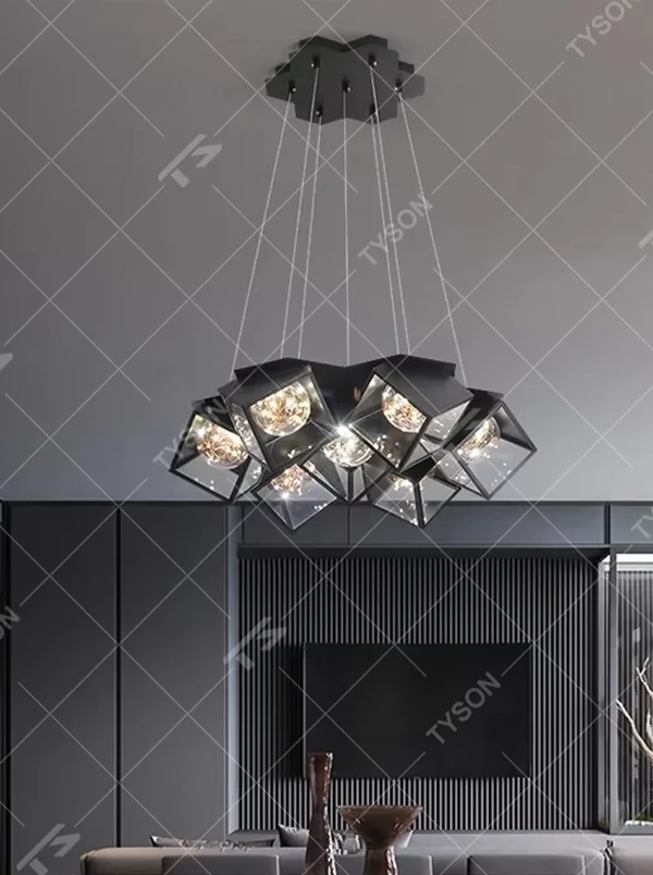A modern industrial style cluster chandelier, featuring a black metal geometric cube structure with mirrored transparent panels and vintage filament bulbs. Its staggered, interlocking design is highly distinctive, combining decorative appeal with practical illumination, ideal for creating a bold and avant-garde space atmosphere.
